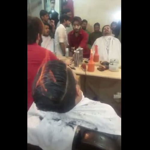 Barber In Pakistan Lights Hair On Fire To Give New Look