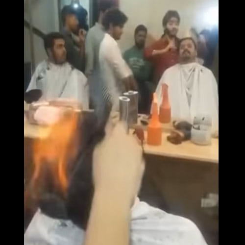 Barber In Pakistan Lights Hair On Fire To Give New Look