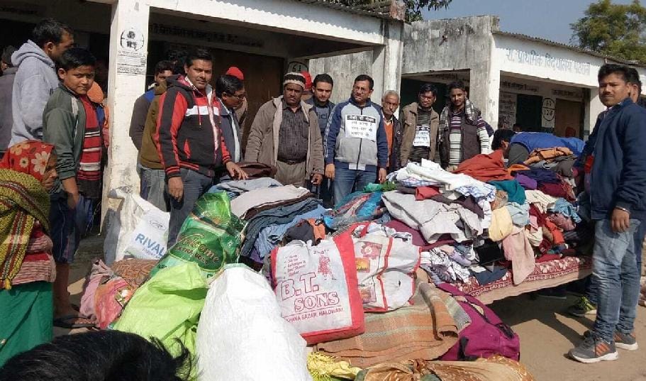 Distributed clothes in the village
