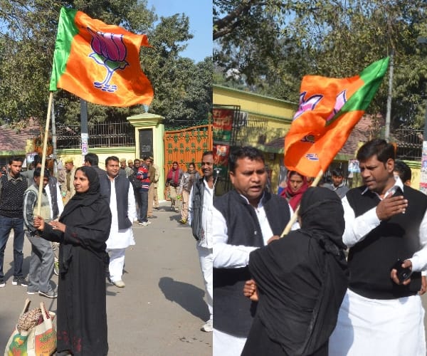  muslim woman with BJP flag in front of SP office.