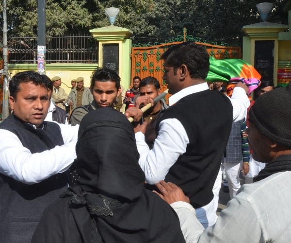  muslim woman with BJP flag in front of SP office.