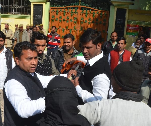  muslim woman with BJP flag in front of SP office.