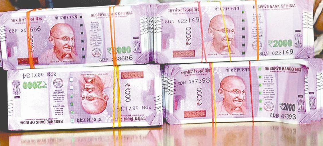 Two businessmen holding 291 600 rupees