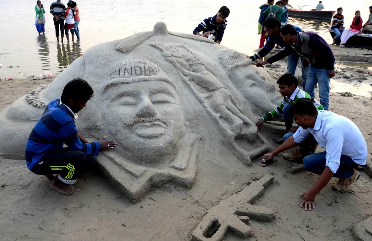 sand artist makes various art on ganga sand at varanasi