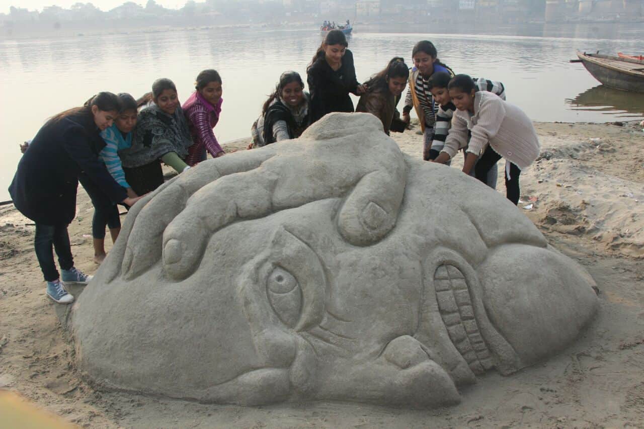 sand artist makes various art on ganga sand at varanasi