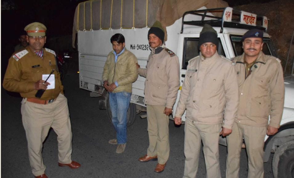 Checking in four cases of country liquor seized