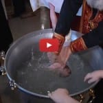 Patriarch of Church dunks babies roughly underwater