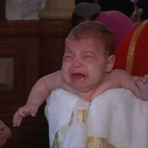 Patriarch of Church dunks babies roughly underwater