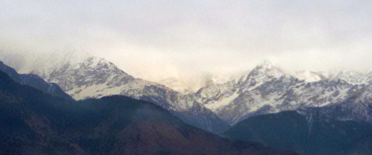 Snow on the high peaks, cold in the district