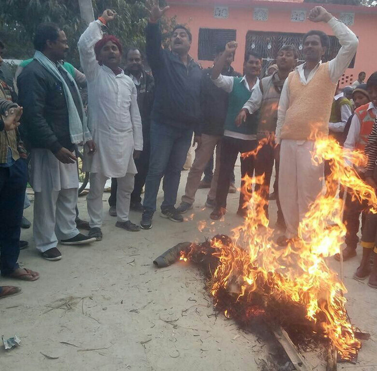 Supporters burnt effigies of Shah
