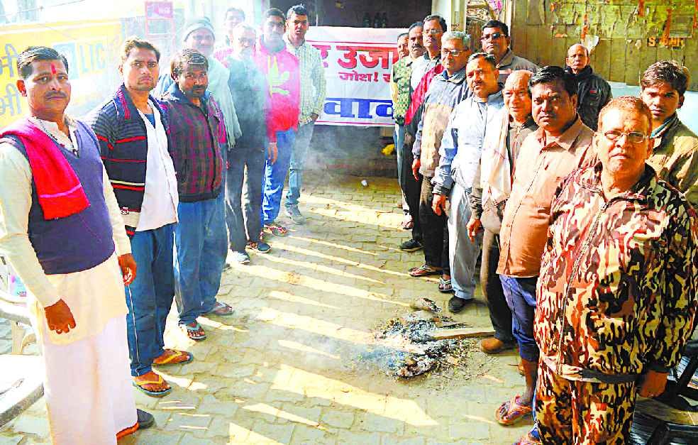 Devotees do the bath, while debris from falling