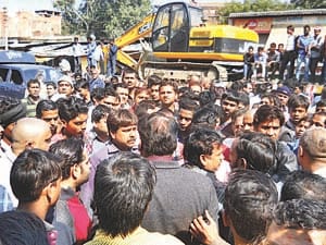 Angry traders clashed with police, and chased CO