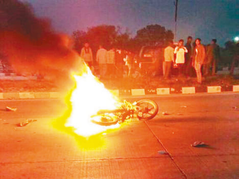 After highway container charred by flames bike