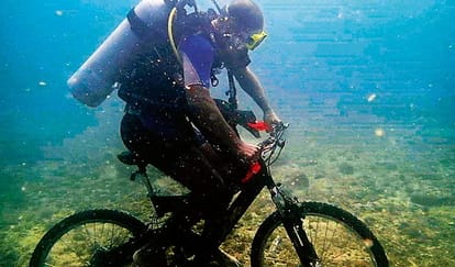 unique sikh boy, inspector daljinder singh drives cycle under 30 feet in sea at karnataka