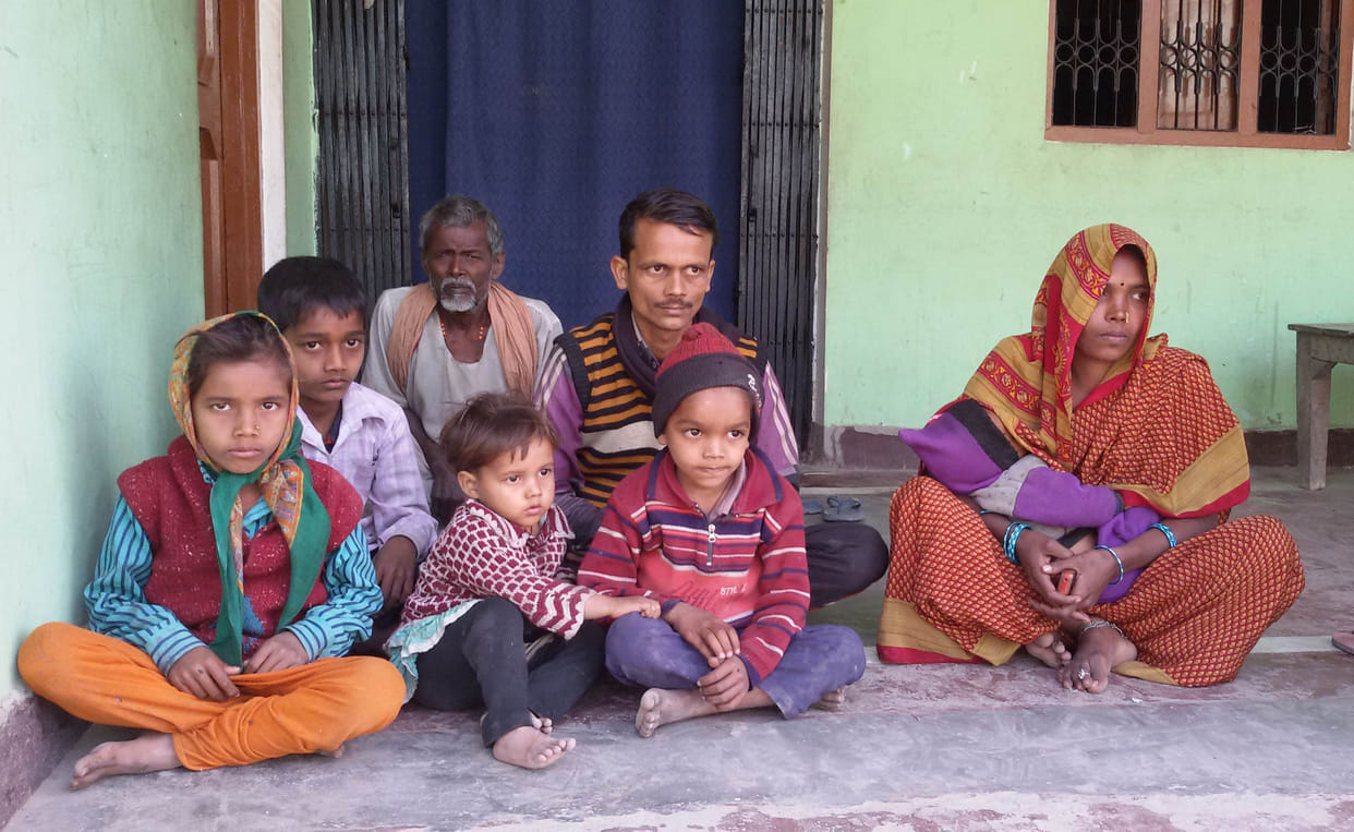 The head of the house with the family sitting on hunger strike