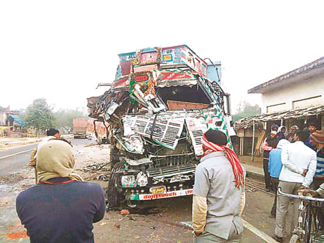Truck driver killed in collision, two injured