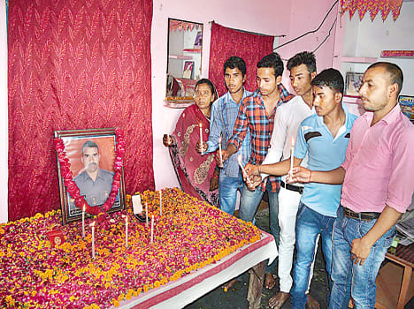 Candle lighting tribute to martyr