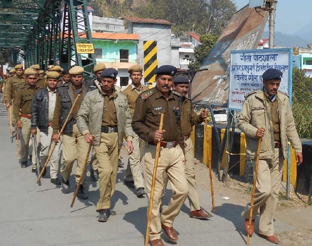 Police and home guard personnel and flag marches