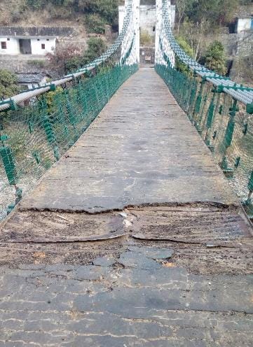 The shabby condition of the pedestrian suspension bridge