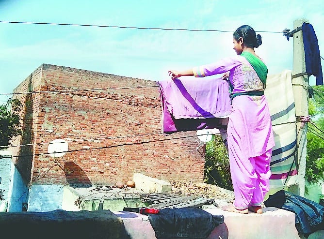 Clothes are dried on electrical wires