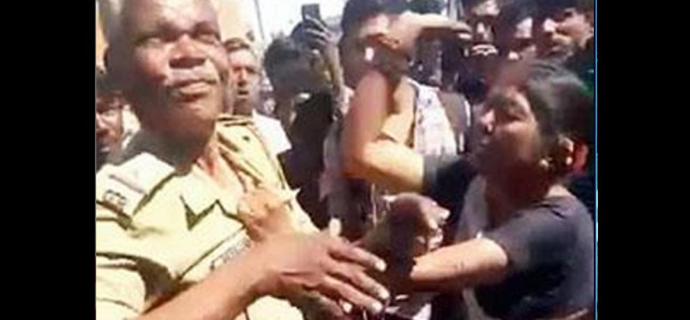 The girl gets beaten with a stick, unconscious