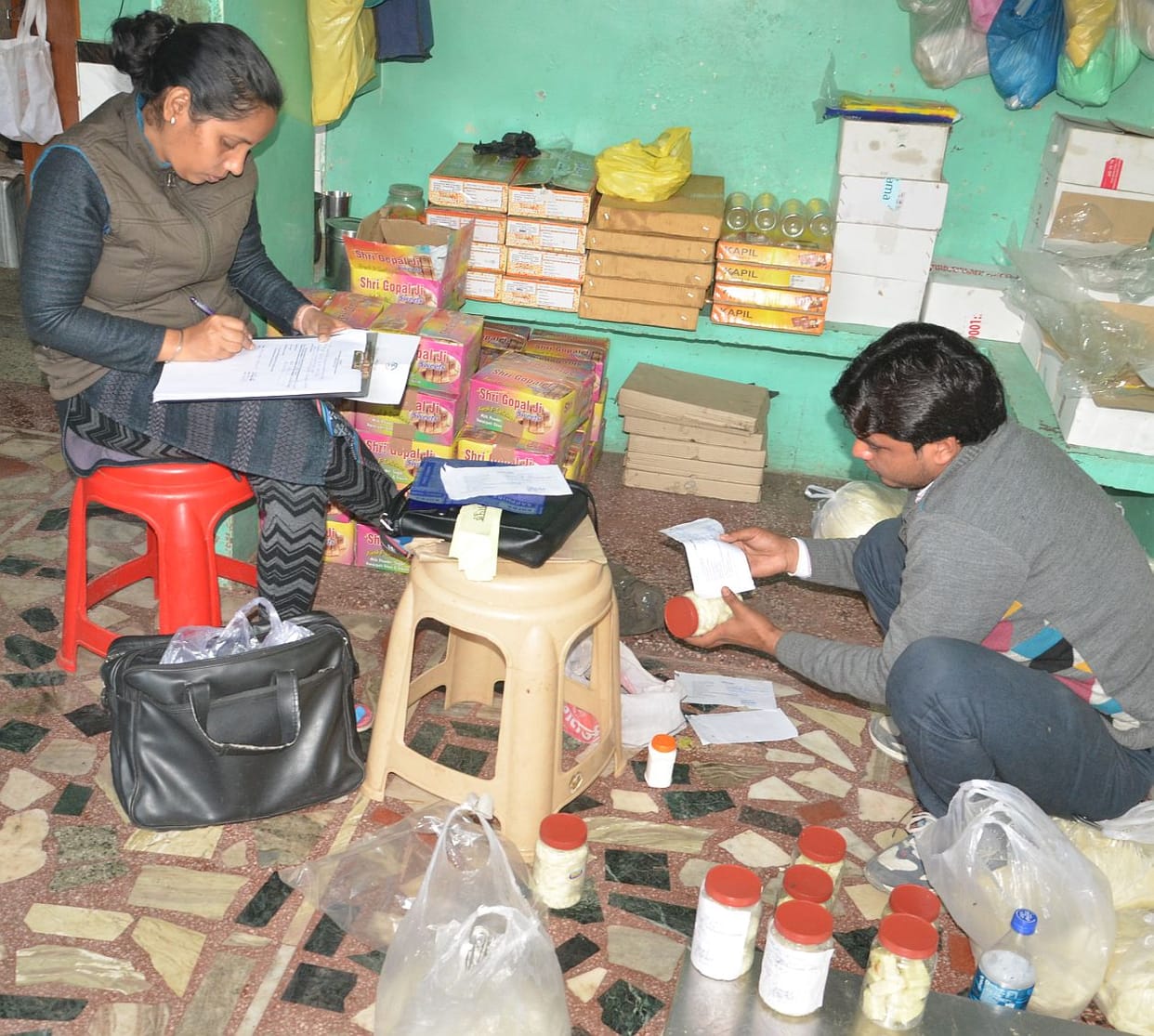 Team filled samples of Mawa, sweets and ghee.