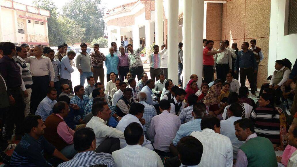 workers demand action against dm due to harassment 