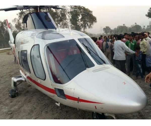  azam khan helicopter landed in a field.