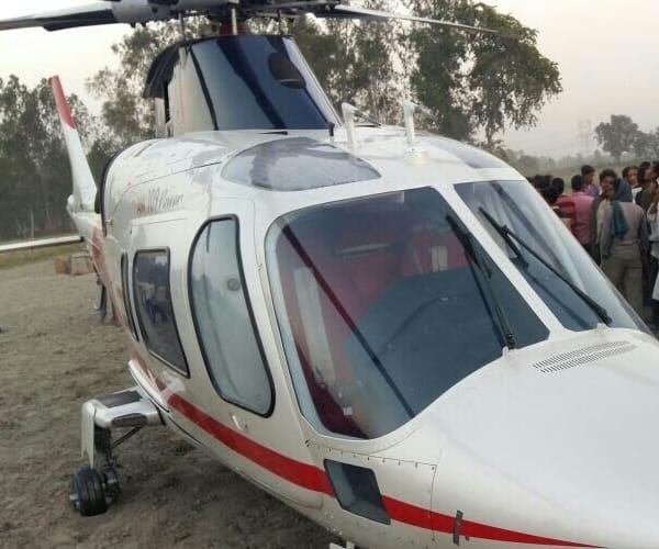  azam khan helicopter landed in a field.