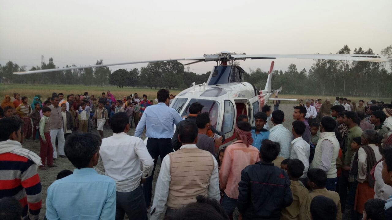  azam khan helicopter landed in a field.