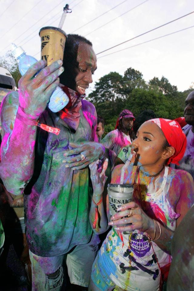 sain Bolt is covered in paint at amazing carnival party in Trinidad