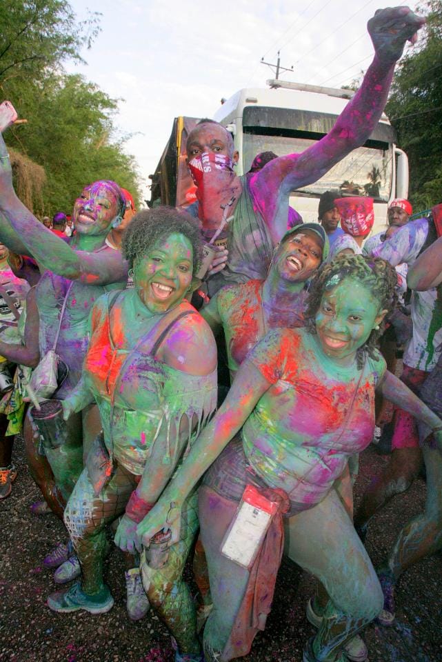 sain Bolt is covered in paint at amazing carnival party in Trinidad