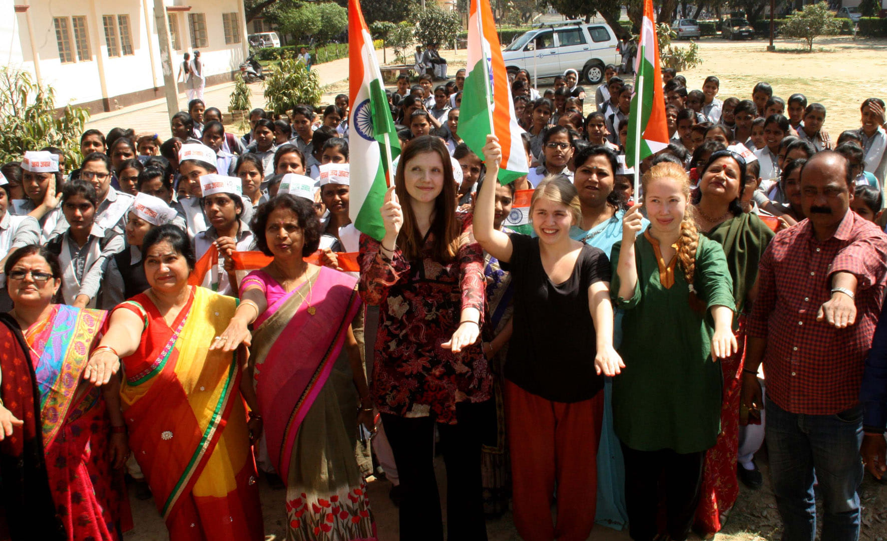 foreigner student hold tiranga for vote campaign in varanasi