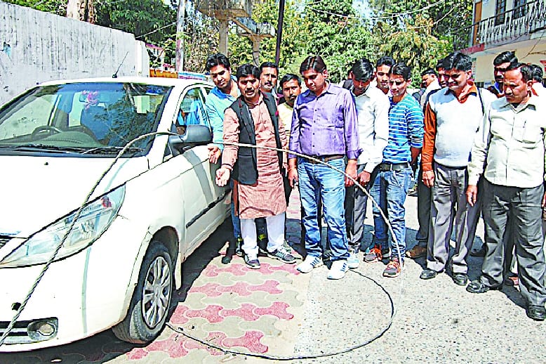 High tension wire fell down on car