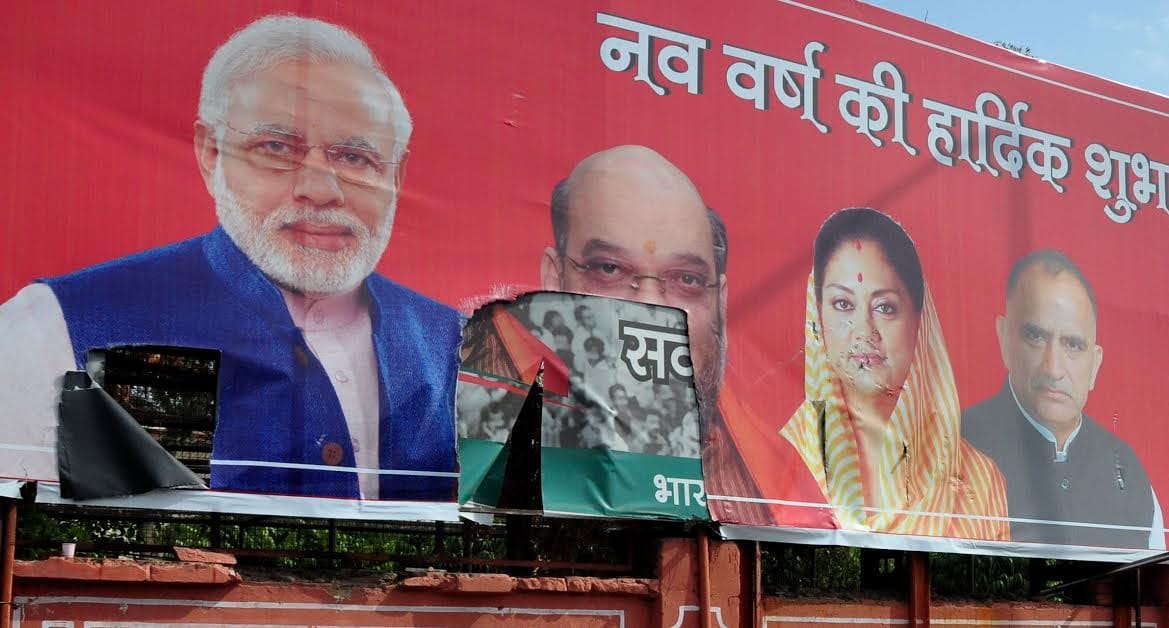 karani sena tore poster of narendra modi during rally