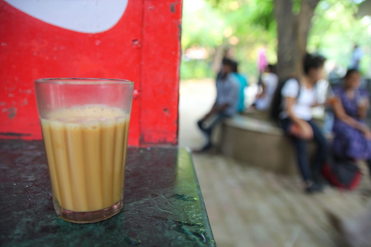 Pocket of passengers cutting into vendor tea sips
