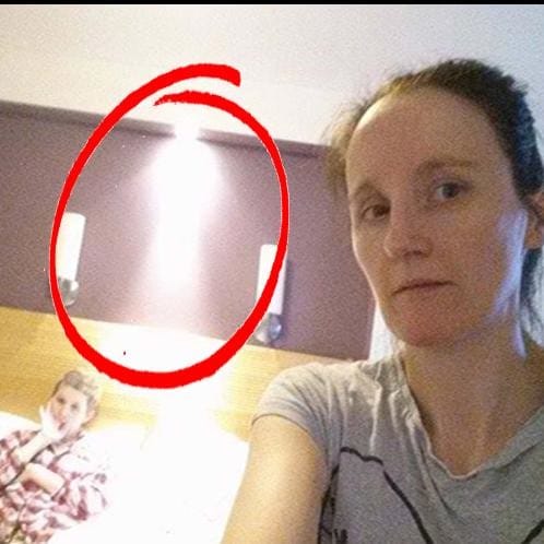 in a selfie there was a strange shape showing behind the person