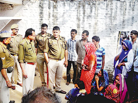 The body of the missing priest hangs from the rope
