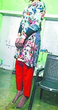 The hands were tied and hanging on the trap was the body of the girl