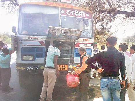 Cushioned passengers watching the smoke in the bus