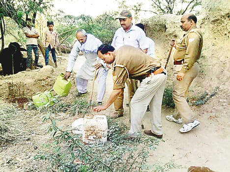 Hidden holes and alcohol recovered in fields