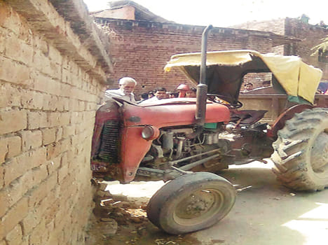 Uncontrollable tractor catches wall, injures five