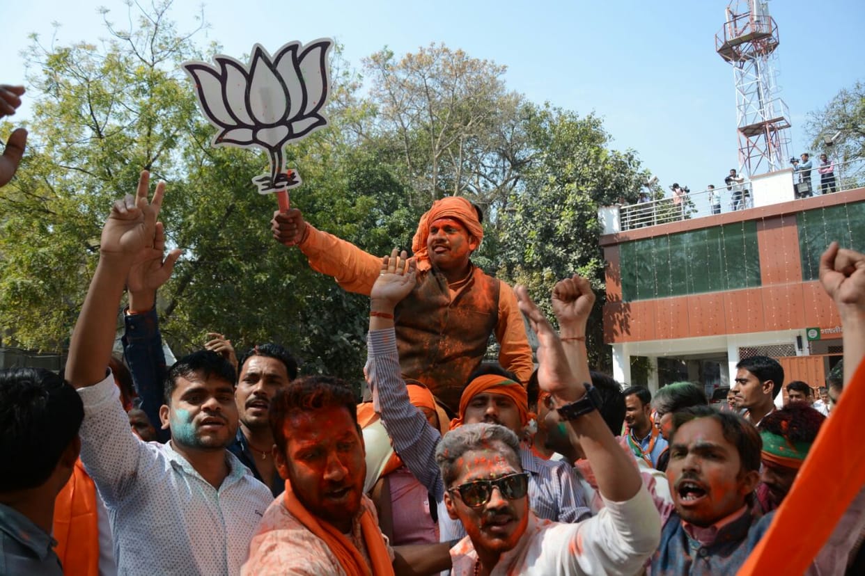  bjp supporters celebrating holi in saffron colour
