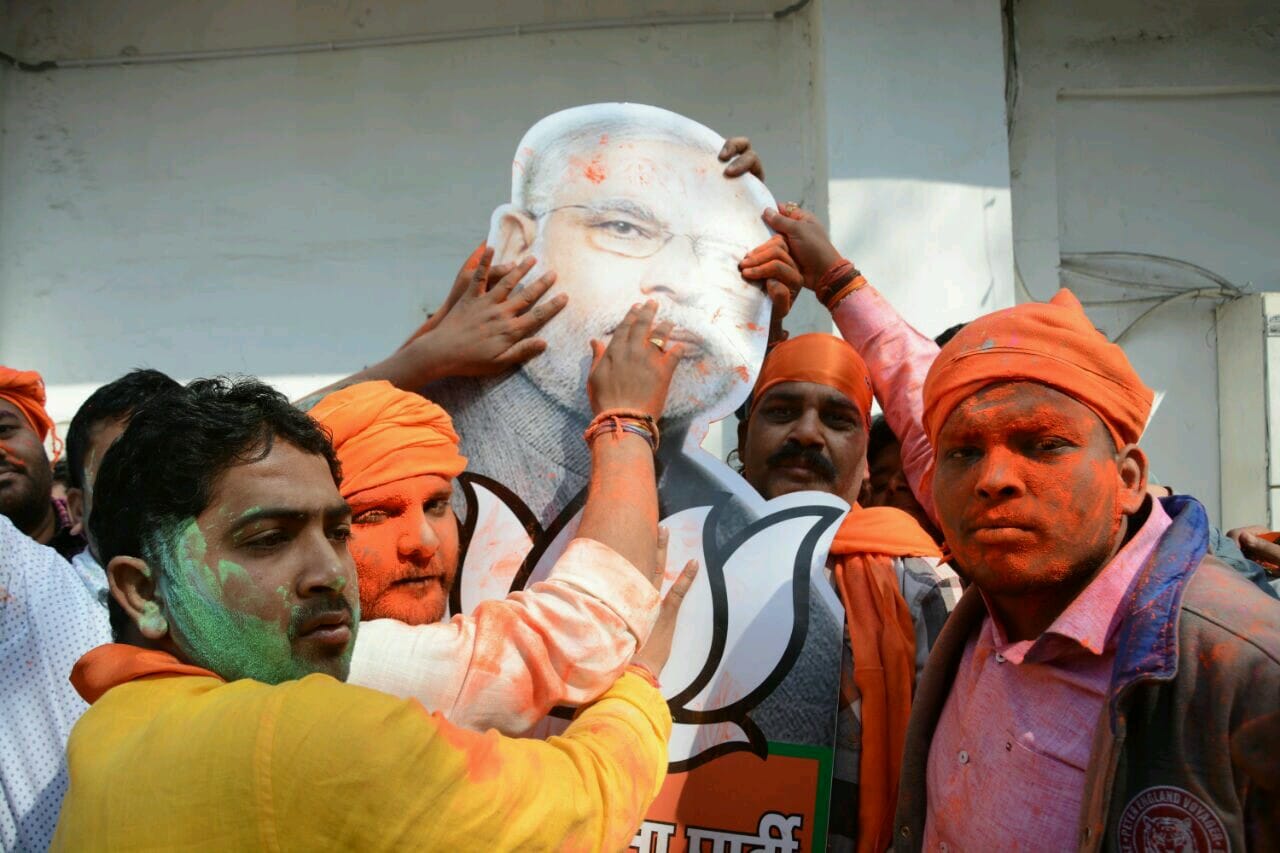  bjp supporters celebrating holi in saffron colour