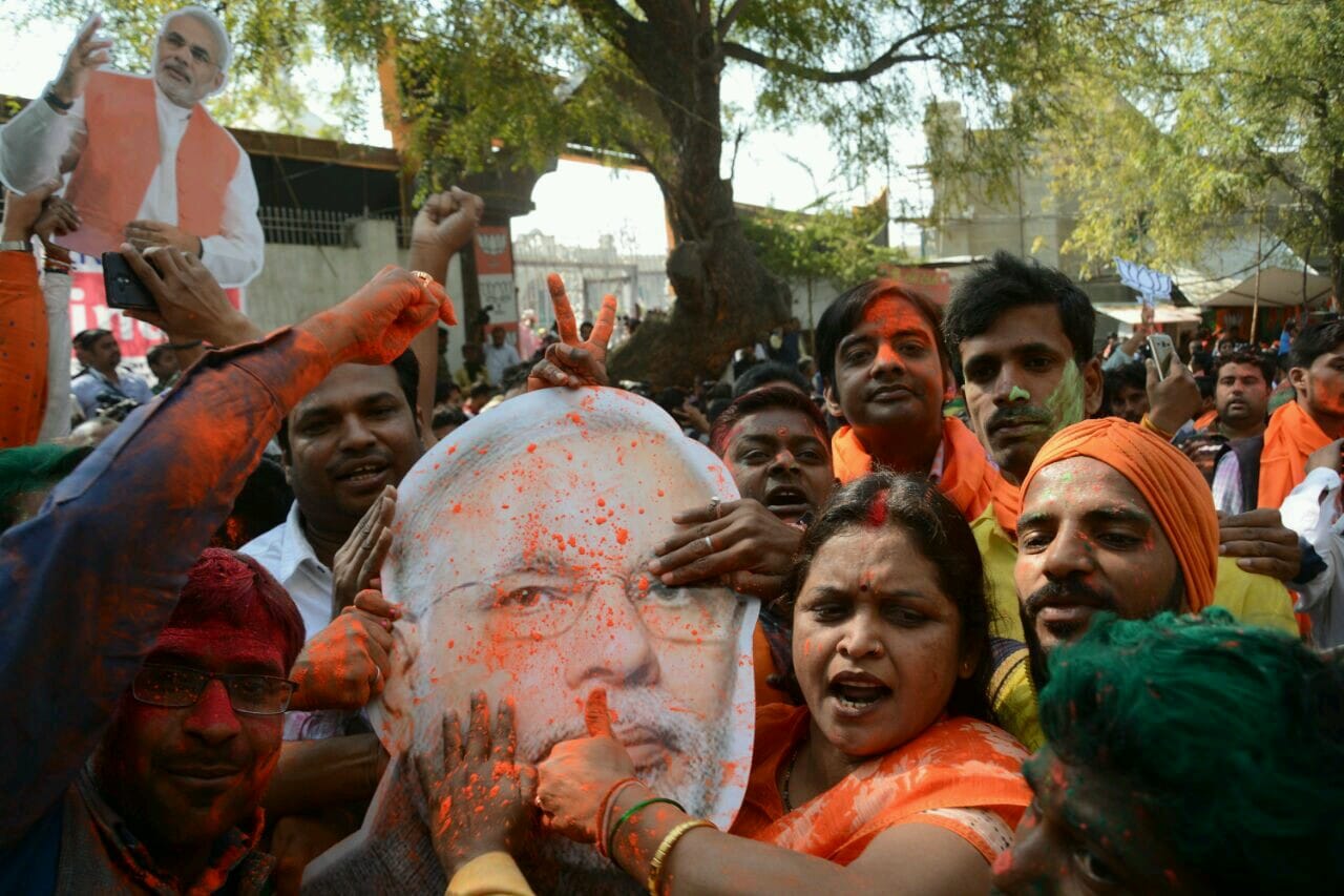  bjp supporters celebrating holi in saffron colour