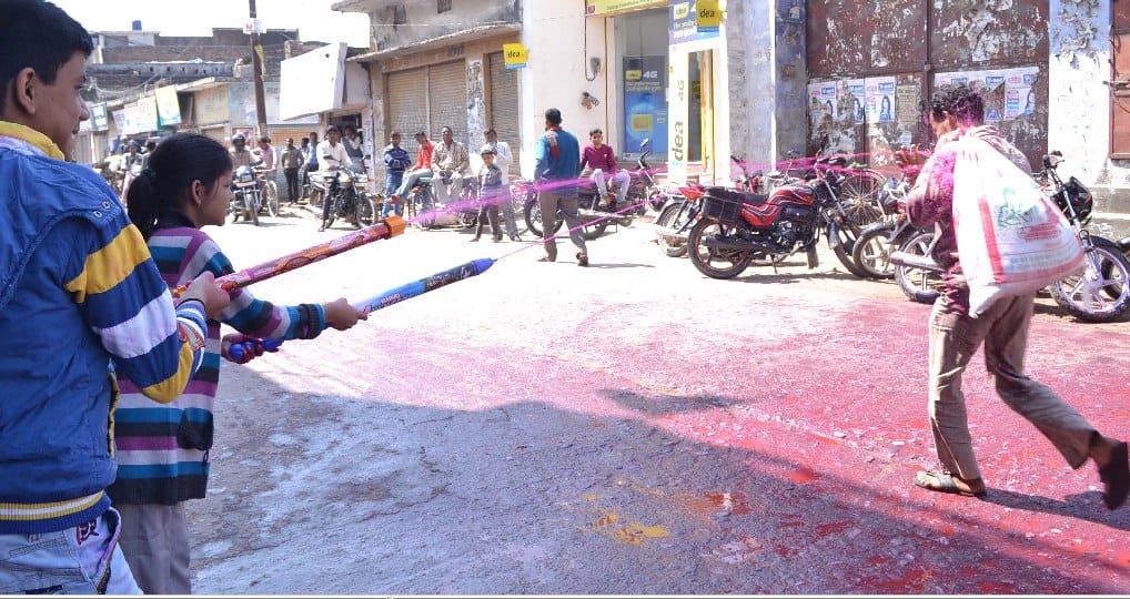 Holi people are drenched in color