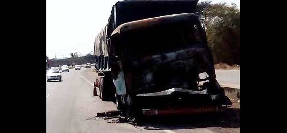 Trailer-canter and truck mounted on highway, fire started