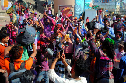 thrown the colours of love and prosperity on the occasion of holi celebration at kashi