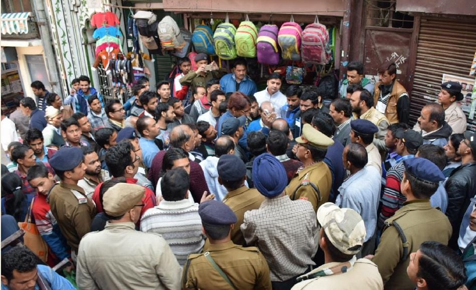 Traders flutter when polythene covered with sari cover