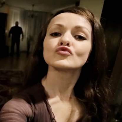 girl take selfi with a strange shadow